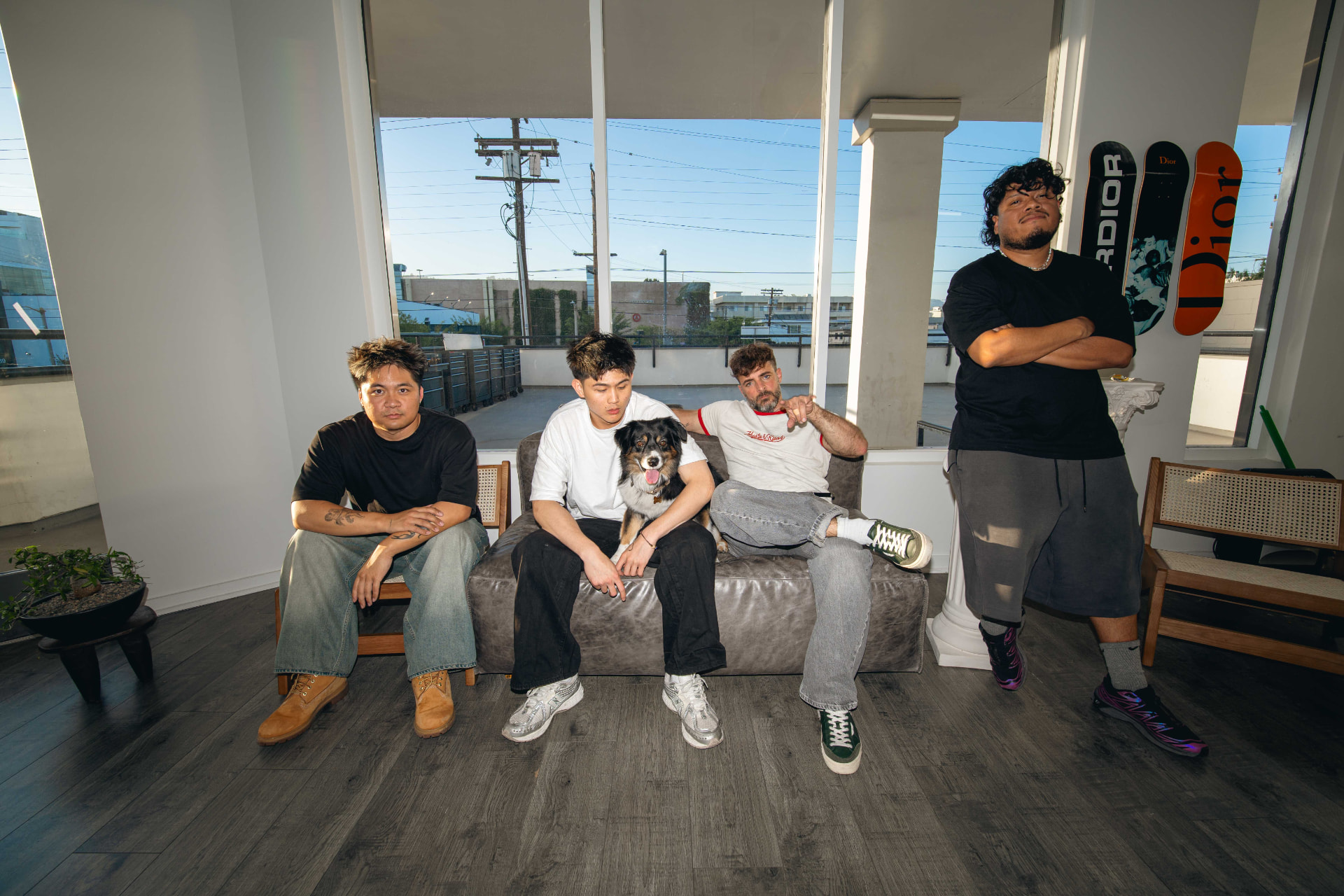 The SIR Los Angeles barber team on the couch in the West 3rd Street shop
